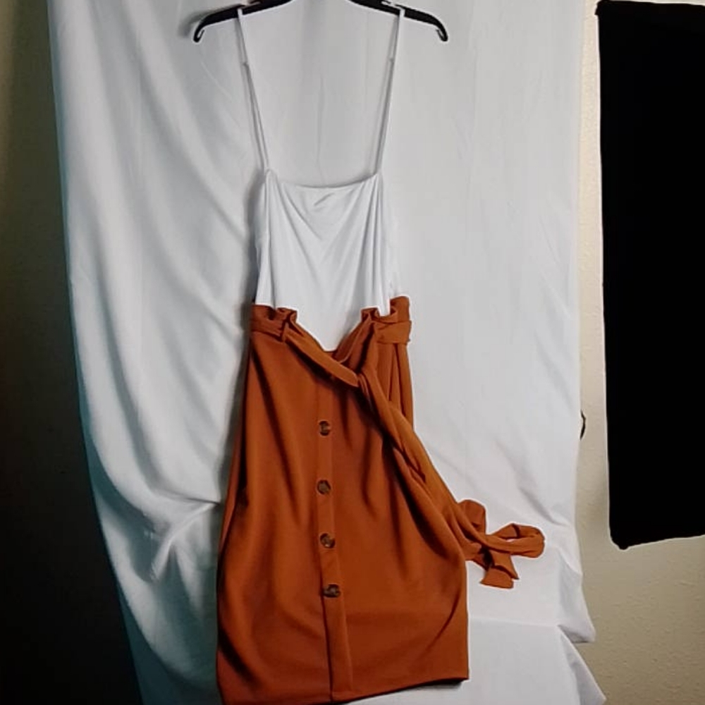 A brown and white midi spaghetti strap dress